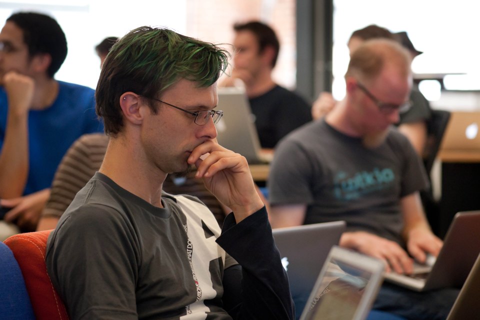 Engineers reviewing code together during a technical training session