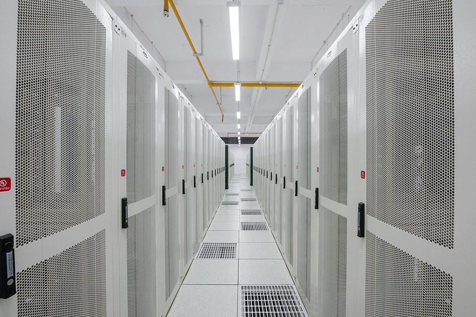 Blue-lit server racks in a data center, representing the web infrastructure fleet that must be patched and verified after the NGINX security release.