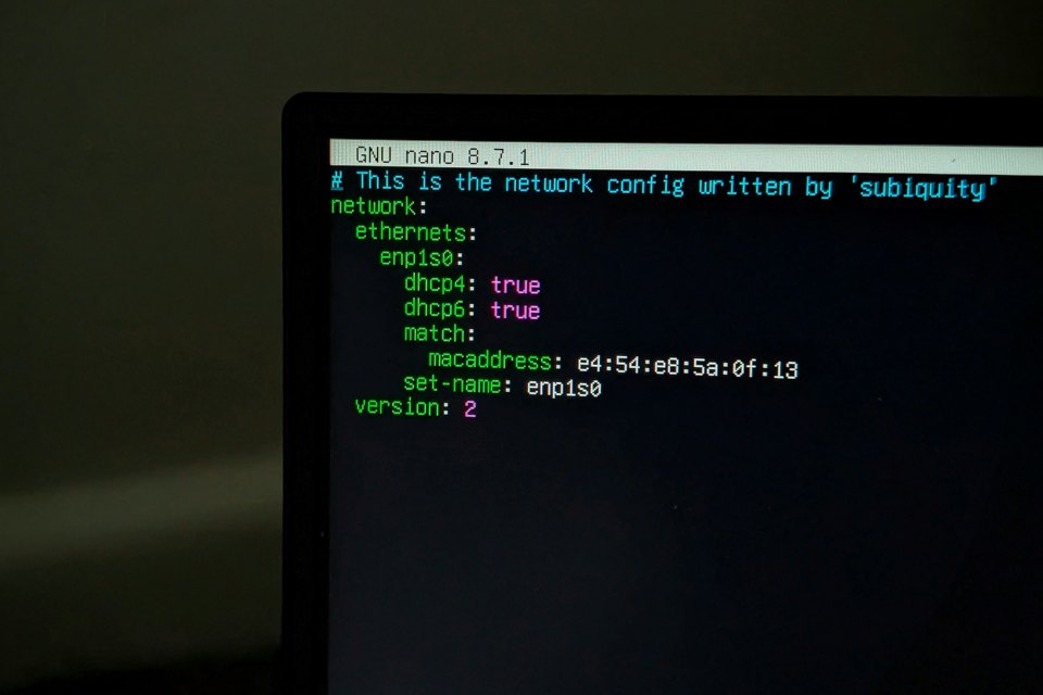 Computer screen showing Linux network configuration in a terminal, illustrating Node.js runtime verification.