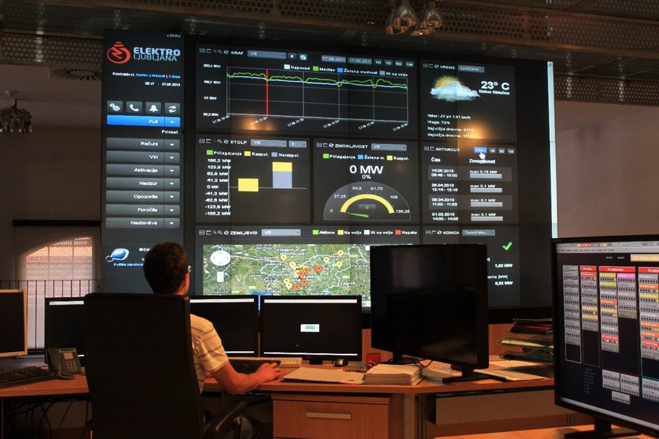 An operator monitoring a modern electricity control center, representing human oversight of consequential automated systems.