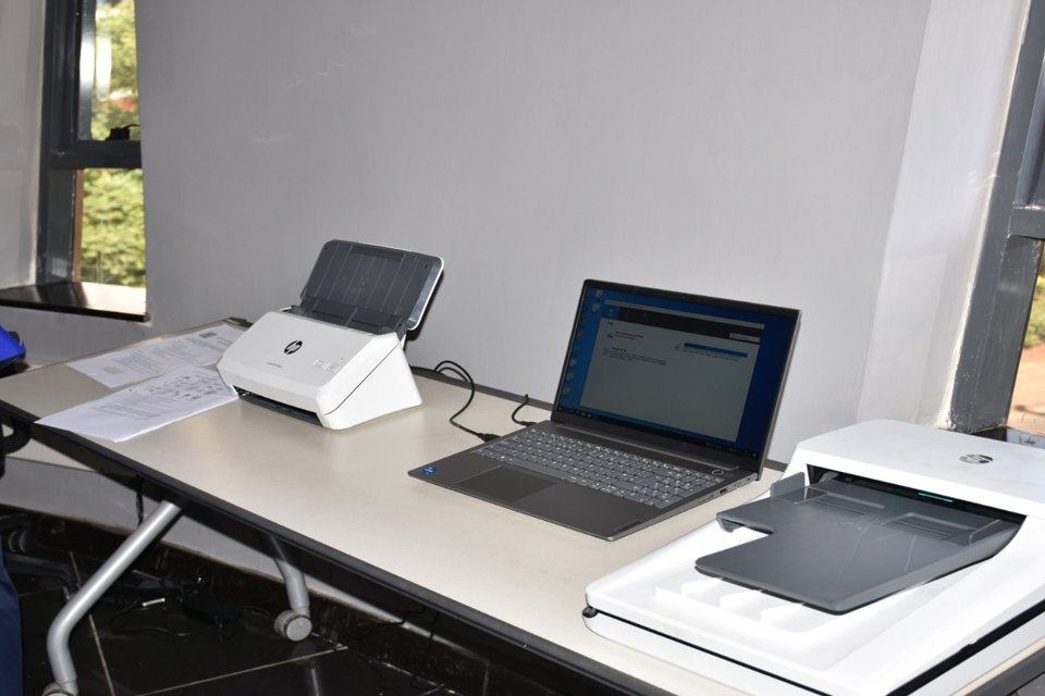 A sheet-fed scanner used to digitize loose documents, illustrating the controlled ingestion boundary before a document enters a RAG index.